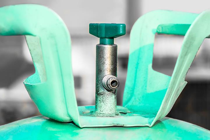 closeup shot of bluish green ac gas regulator