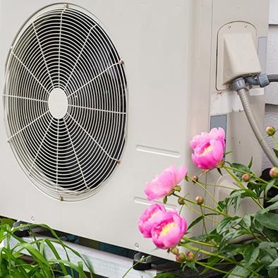 air conditioning heat pump unit on side of a home
