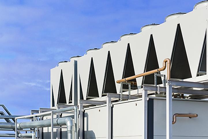 pipes leading to series of ventillation chillers system outside