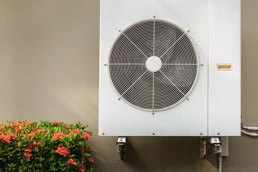 compressor air conditioning system mounted on building exterior wall