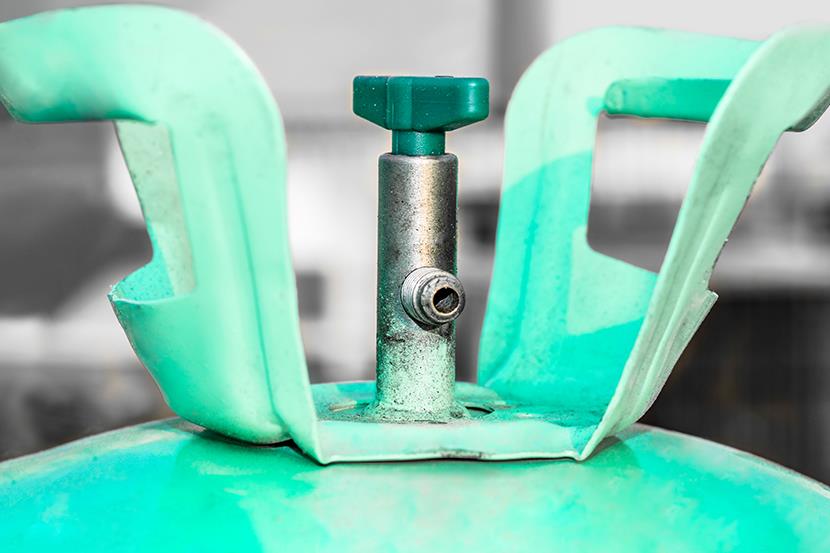 closeup shot of bluish green ac gas regulator