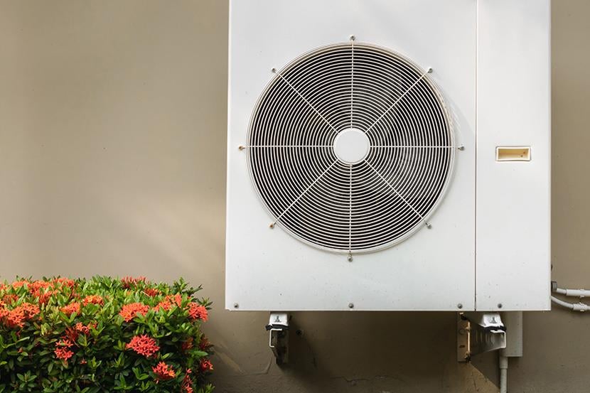 compressor air conditioning system mounted on building exterior wall